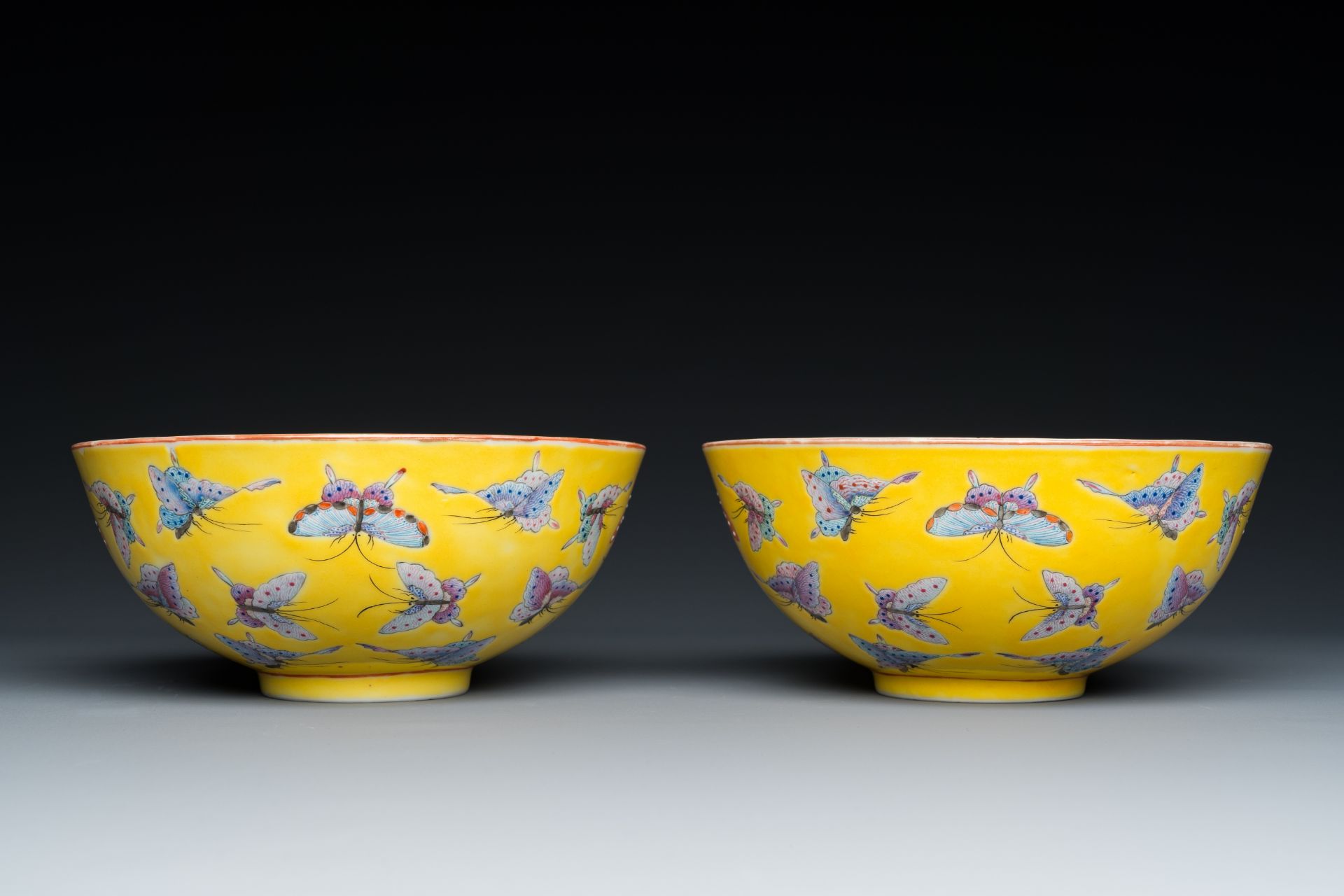 A pair of Chinese famille rose yellow-ground 'butterfly' bowls, Tongzhi mark and of the period - Image 2 of 7