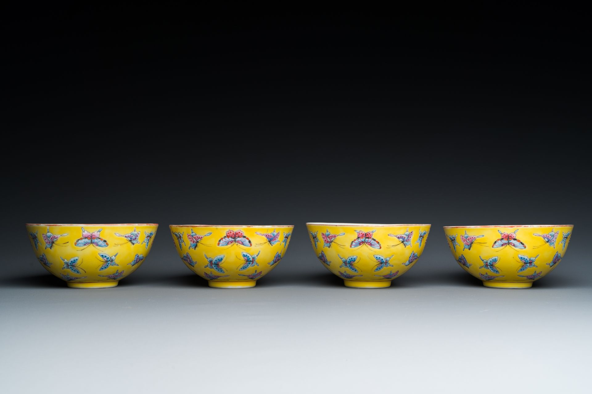 Four Chinese famille rose yellow-ground 'butterfly' bowls, Tongzhi mark and of the period - Image 3 of 7