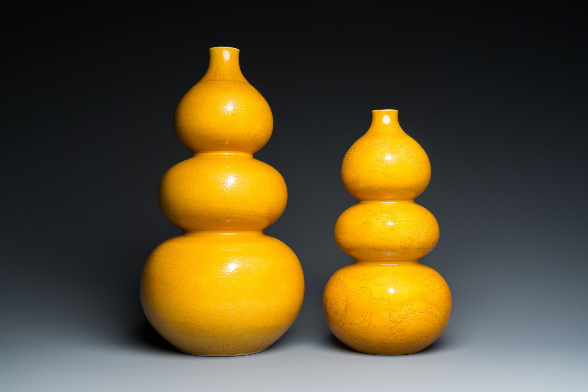 Two Chinese monochrome yellow-glazed triple gourd vases with incised designs of lotus scrolls and dr - Image 2 of 7