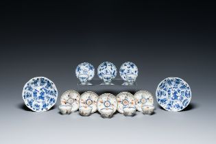 Two Chinese blue and white plates, three cups and saucers and five famille verte cups and saucers, K