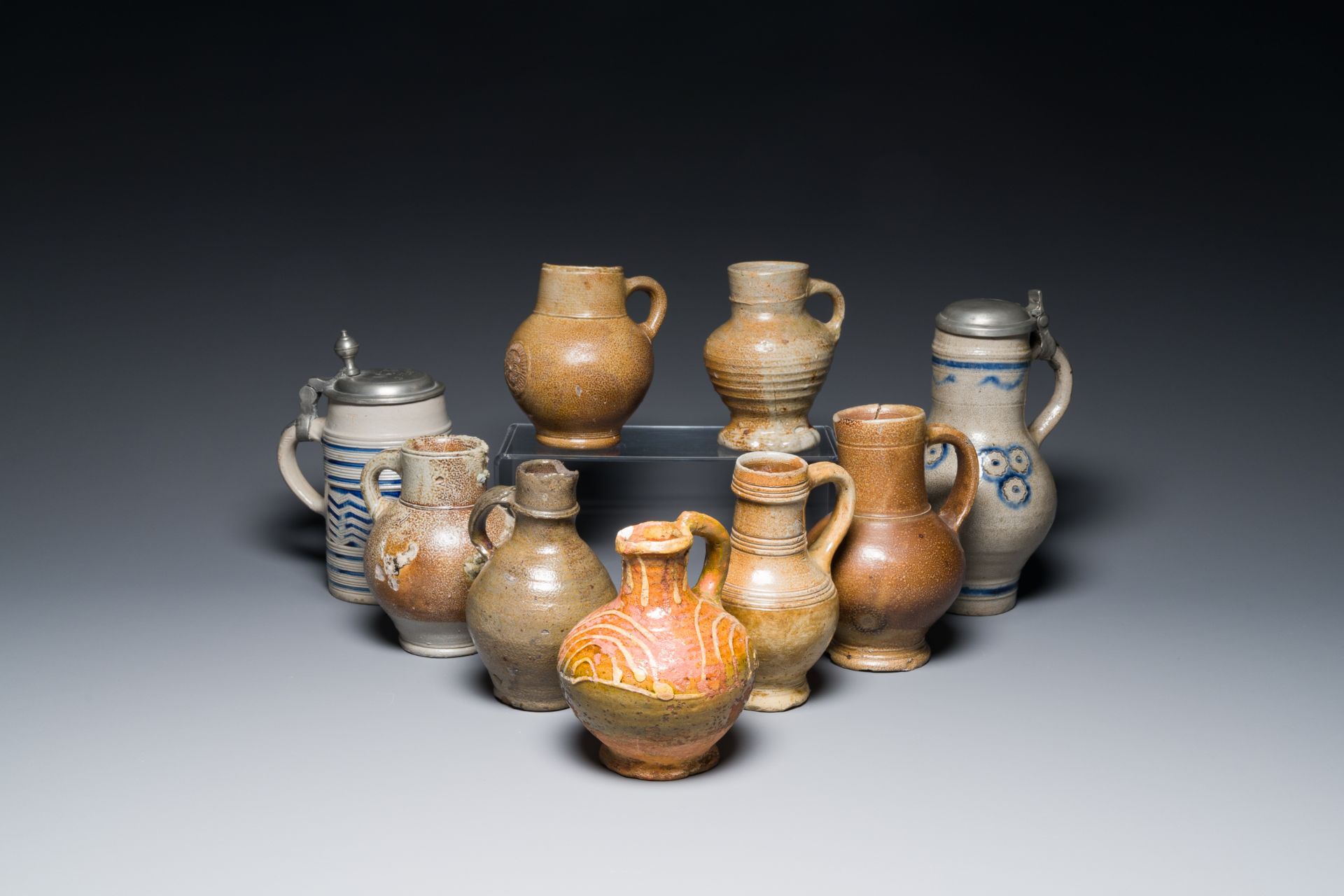 Nine various stoneware jugs, a.o. Frechen, Raeren and Westerwald, 16/18th C.