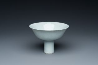 A Chinese monochrome white-glazed stem cup with anhua dragon design, Qianlong mark, 18/19th C.