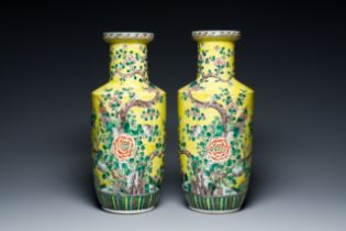 A pair of Chinese yellow-ground famille verte rouleau vases, 19th C.