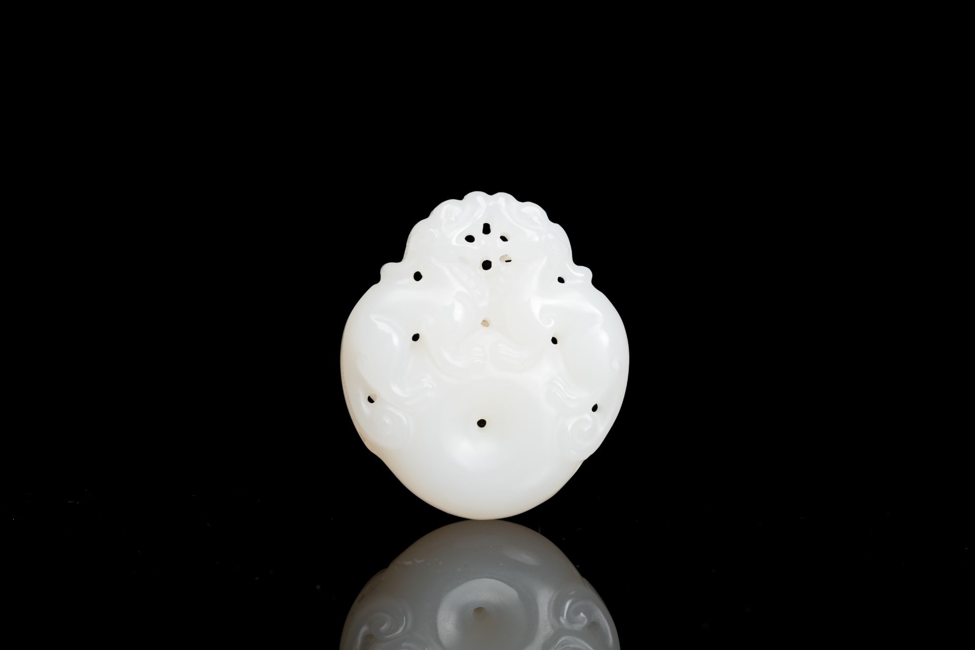 A Chinese white jade 'mythical beasts' pendant, Qing - Image 2 of 2