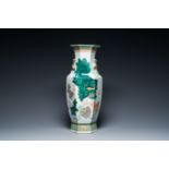 A Chinese hexagonal famille verte 'Buddhist lions and deer' vase, 19th C.