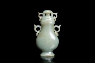 A Chinese celadon jade vase and cover, 19/20th C.