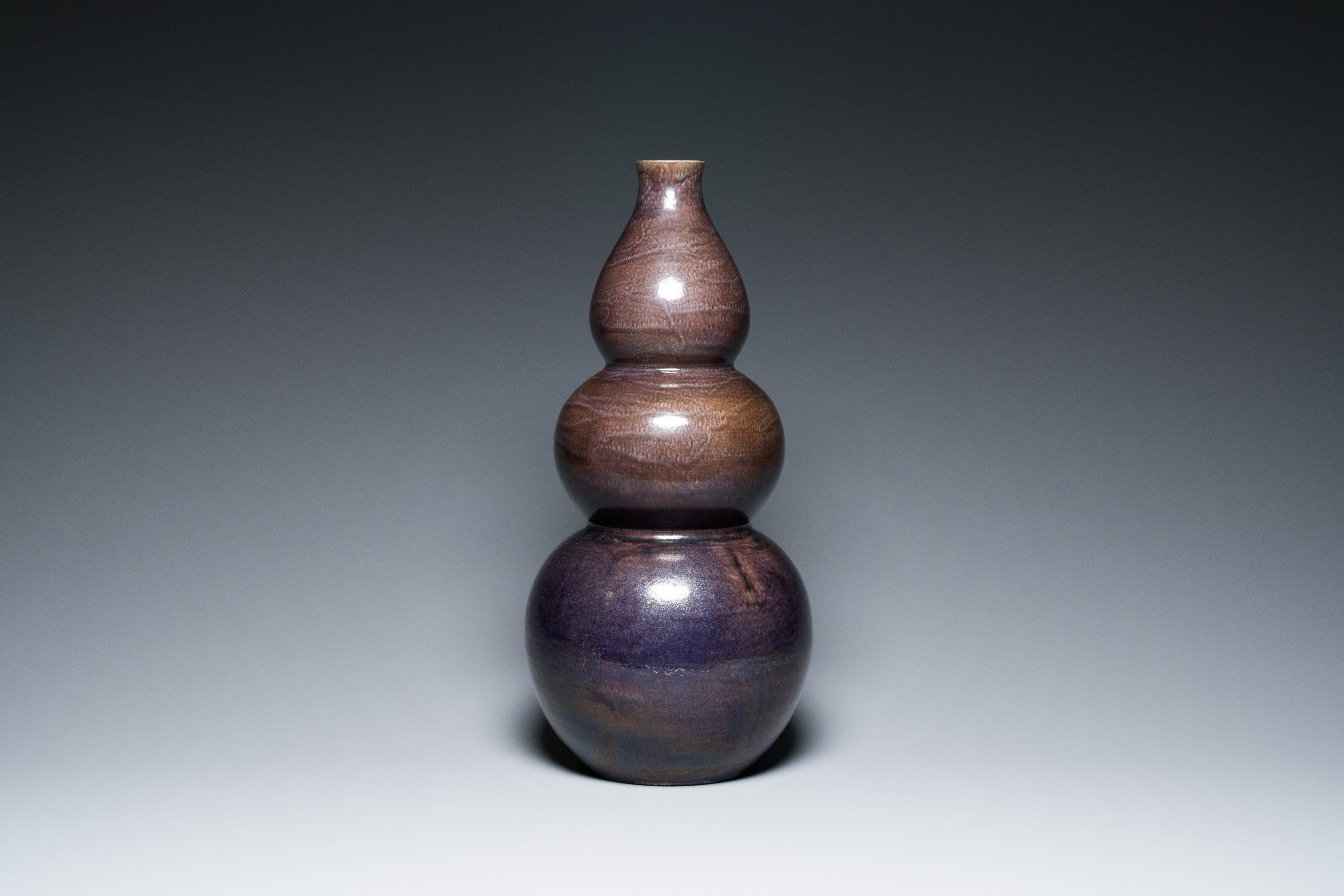 A large Chinese aubergine-glazed triple gourd vase, 18th C. - Image 3 of 6
