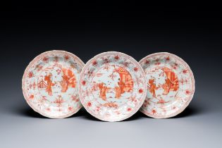 Three Chinese iron-red and gilt lotus-shaped plates, Kangxi