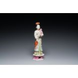 A tall Chinese famille rose 'nodding head' figure, 19/20th C.