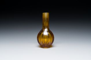 A Chinese facetted translucent green-coloured Peking glass bottle vase, Qianlong mark, 19th C.