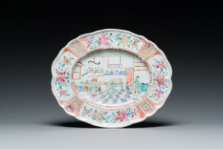 A polychrome petit feu Dutch Delft oval dish with a shop interior, 18th C.