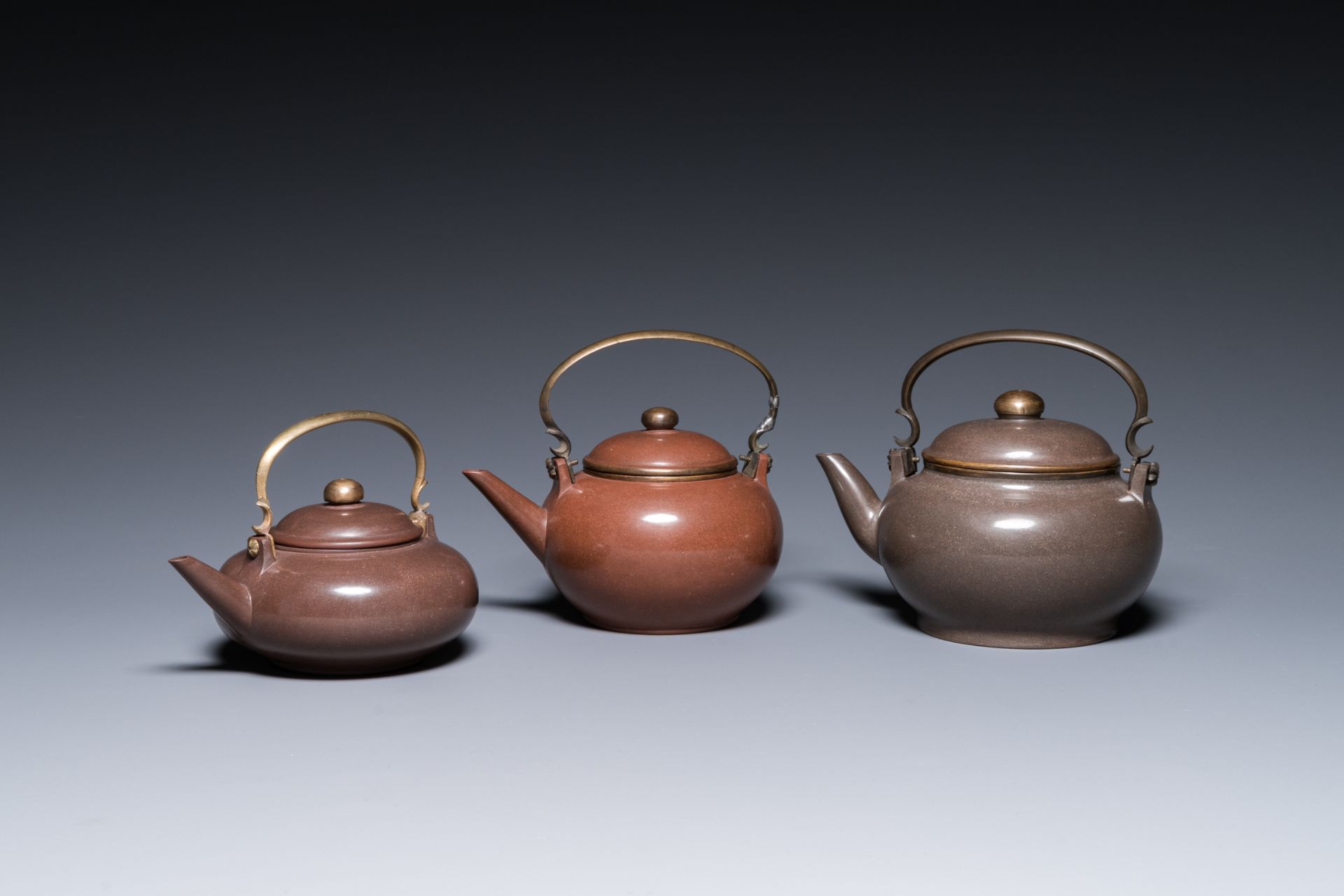 Three Chinese polished Yixing stoneware teapots and covers for the Thai market, Gong Ju è´¡å±€ mark,