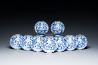 Nine Chinese blue and white 'Madonna and Child' saucers and two cups, Kangxi