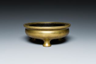 A Chinese bronze tripod censer, Xuande mark, 18th C.