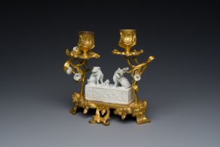 A Chinese Dehua blanc de Chine joss stick holder with French gilt bronze candlestick mounts, Kangxi
