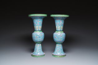 A pair of Chinese Canton enamel 'gu' vases with floral design, Qianlong