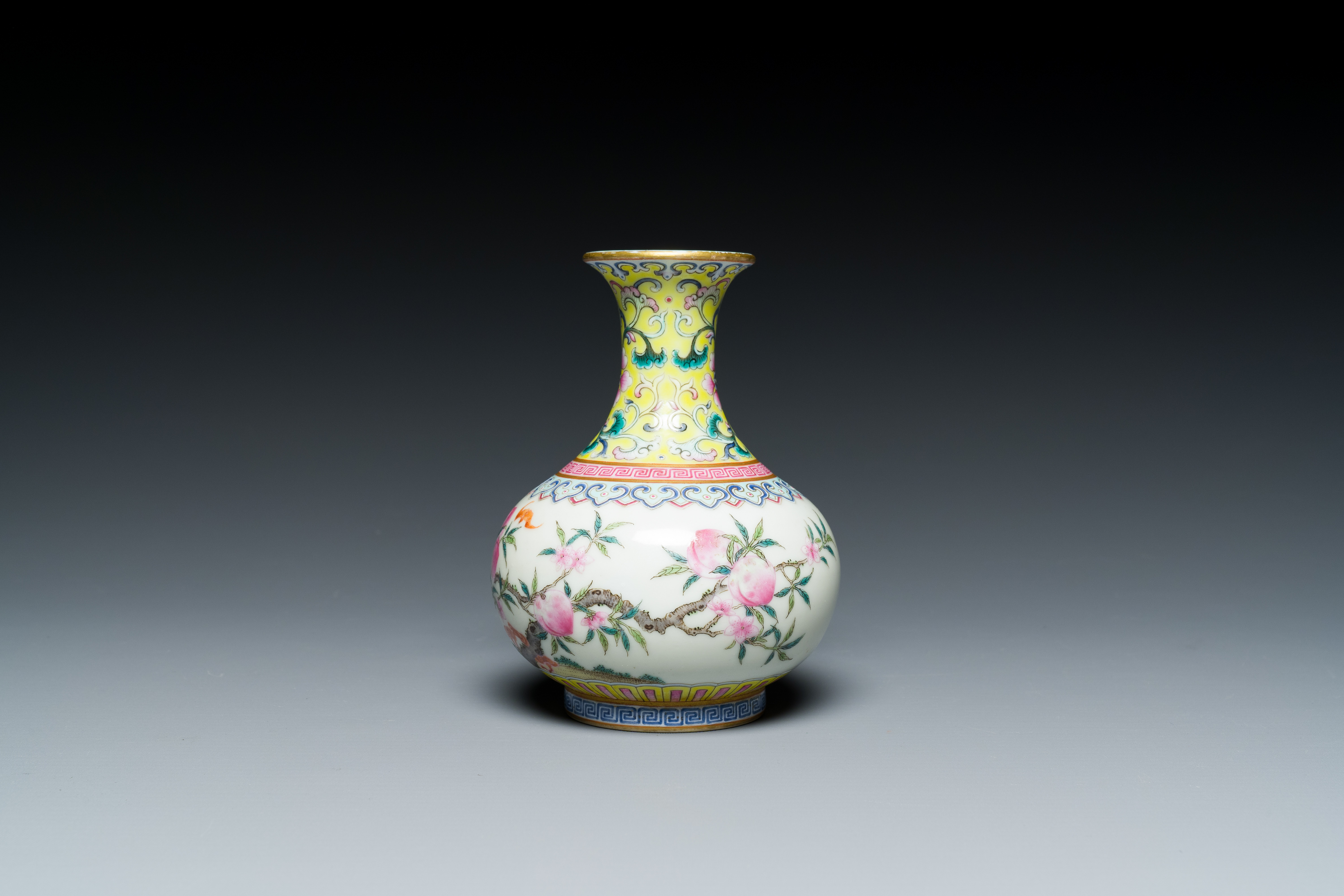 A small Chinese famille rose 'nine peaches' bottle vase, Jiaqing mark, 20th C. - Image 5 of 7