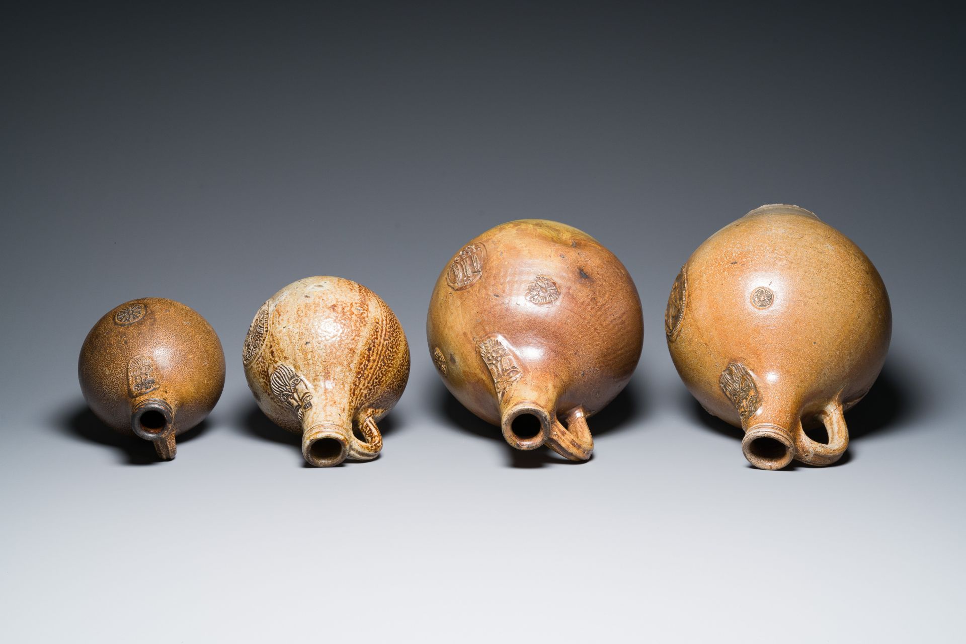 Four stoneware bellarmine jugs with various seals, Frechen and Cologne, Germany, early 17th C. - Image 6 of 7