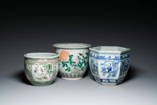 Three Chinese blue and white, famille rose and famille verte fish bowls and jardinieres, 19th C.