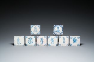 Eight Dutch Delft blue and white tiles with a jester, craftsmen at work and playing children, 17th C