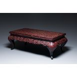 A Chinese rectangular carved red and black lacquer table, 'kang', Xuande mark, 20th C.