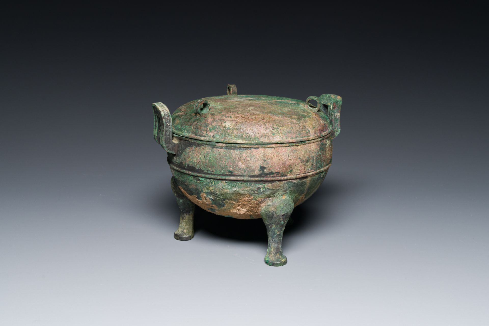 A Chinese archaic bronze tripod vessel and cover, 'ding', Eastern Zhou, Spring and Autumn period