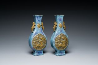 A pair of Chinese flambe-glazed vases with gilt 'dragon' medallions, Qianlong mark, 19th C.
