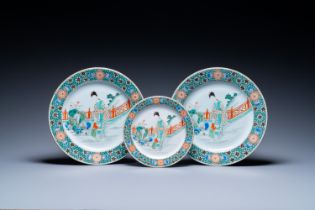 A pair of Chinese famille verte dishes and a plate with a mother and her son, Kangxi