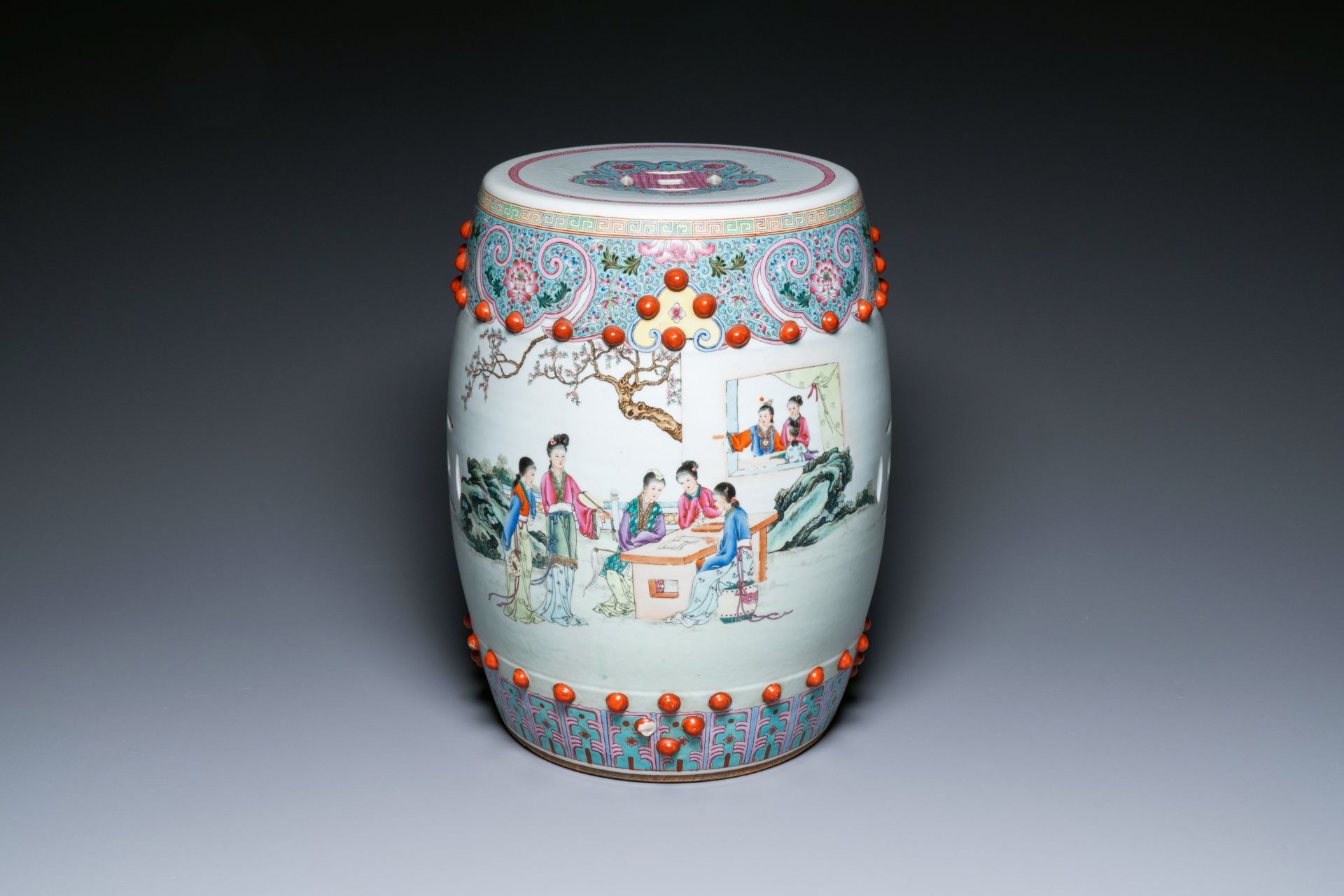 A Chinese famille rose garden seat with ladies in a garden, 20th C.