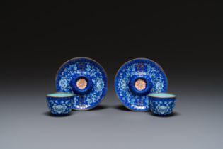 A pair of Chinese Canton enamel trembleuse cups on stands with double 'Shou' design, Qianlong