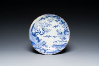 A Japanese blue and white Arita dish with a tiger and a dragon in Kakiemon-style, Fuku mark, Edo, la