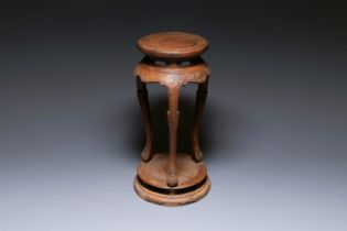 A Chinese huanghuali wood circular incense stand with mythic animals, 'xiangji', Ming