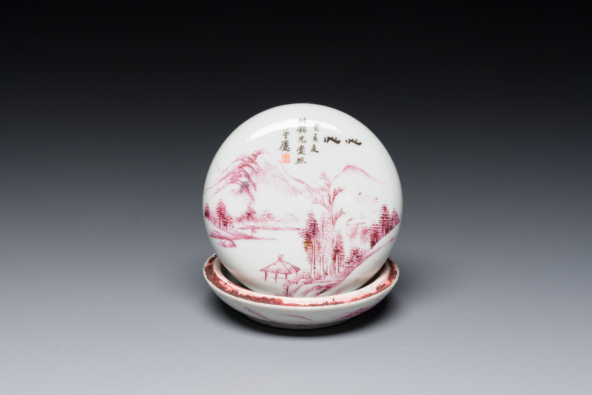 A Chinese purple-decorated seal paste box and cover with a landscape, signed Qing æ…¶, Mei ç¾Ž seal