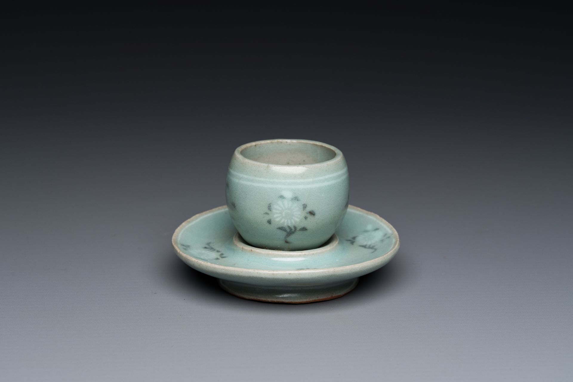 A Korean inlaid celadon cup on a stand, probably Goryeo, 13/14th C.