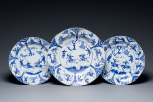 Three large deep Chinese blue and white 'hunting scene' dishes, Chenghua mark, Kangxi