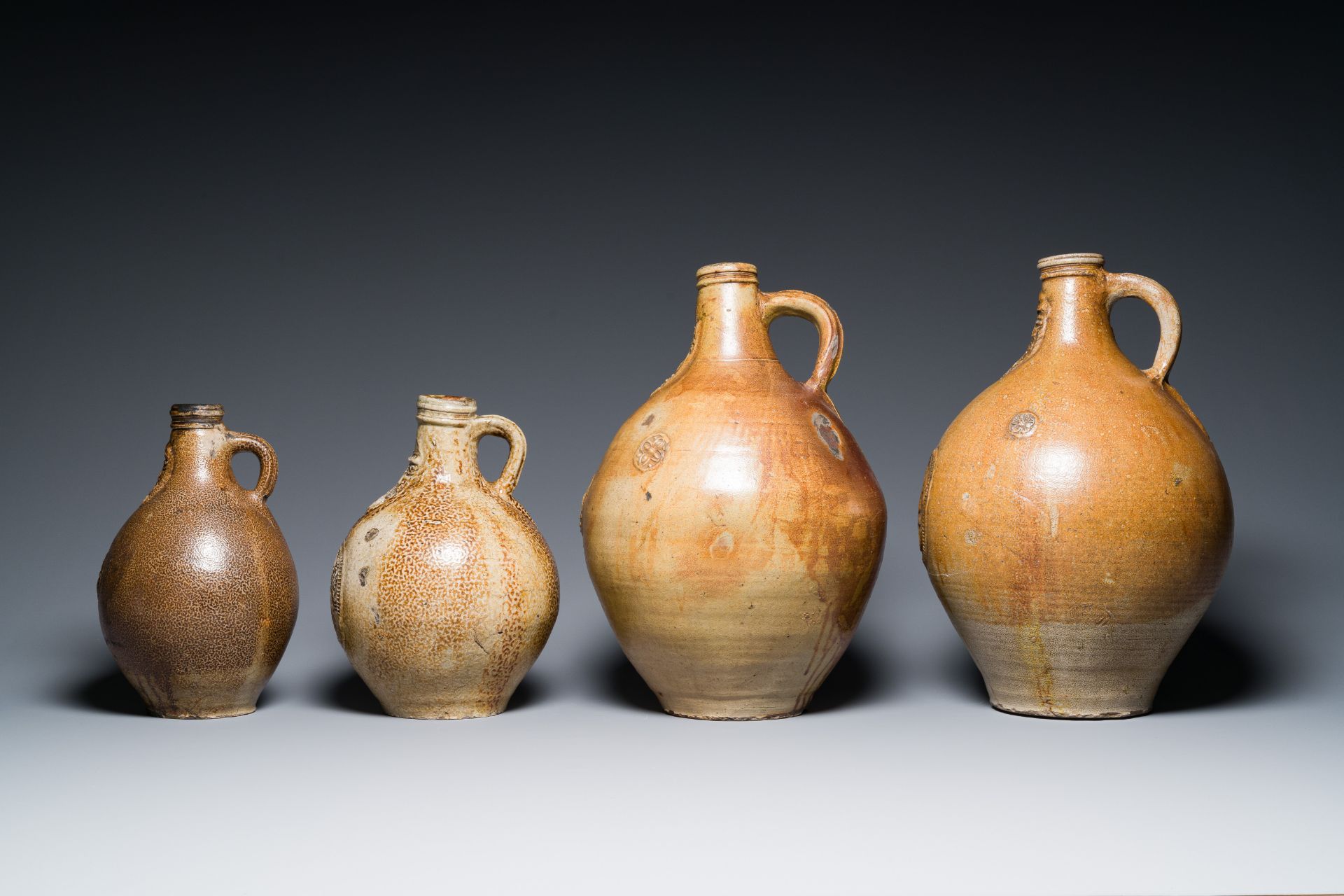 Four stoneware bellarmine jugs with various seals, Frechen and Cologne, Germany, early 17th C. - Image 4 of 7