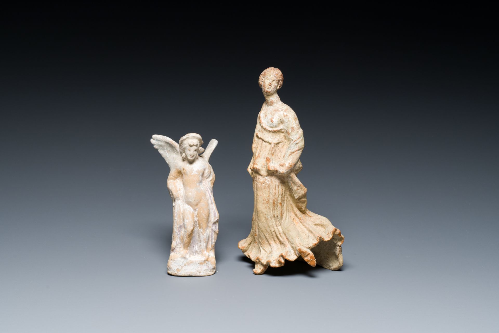 Two Greek terracotta sculptures of Eros and of a female dancer, 4th/2nd C. b.C.