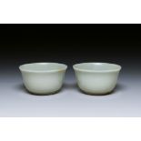 A pair of Chinese pale celadon jade bowls, 19th C.