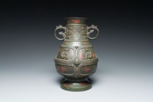 A Chinese gold and silver-inlaid bronze vase with pseudo-rust patina, 18th C.