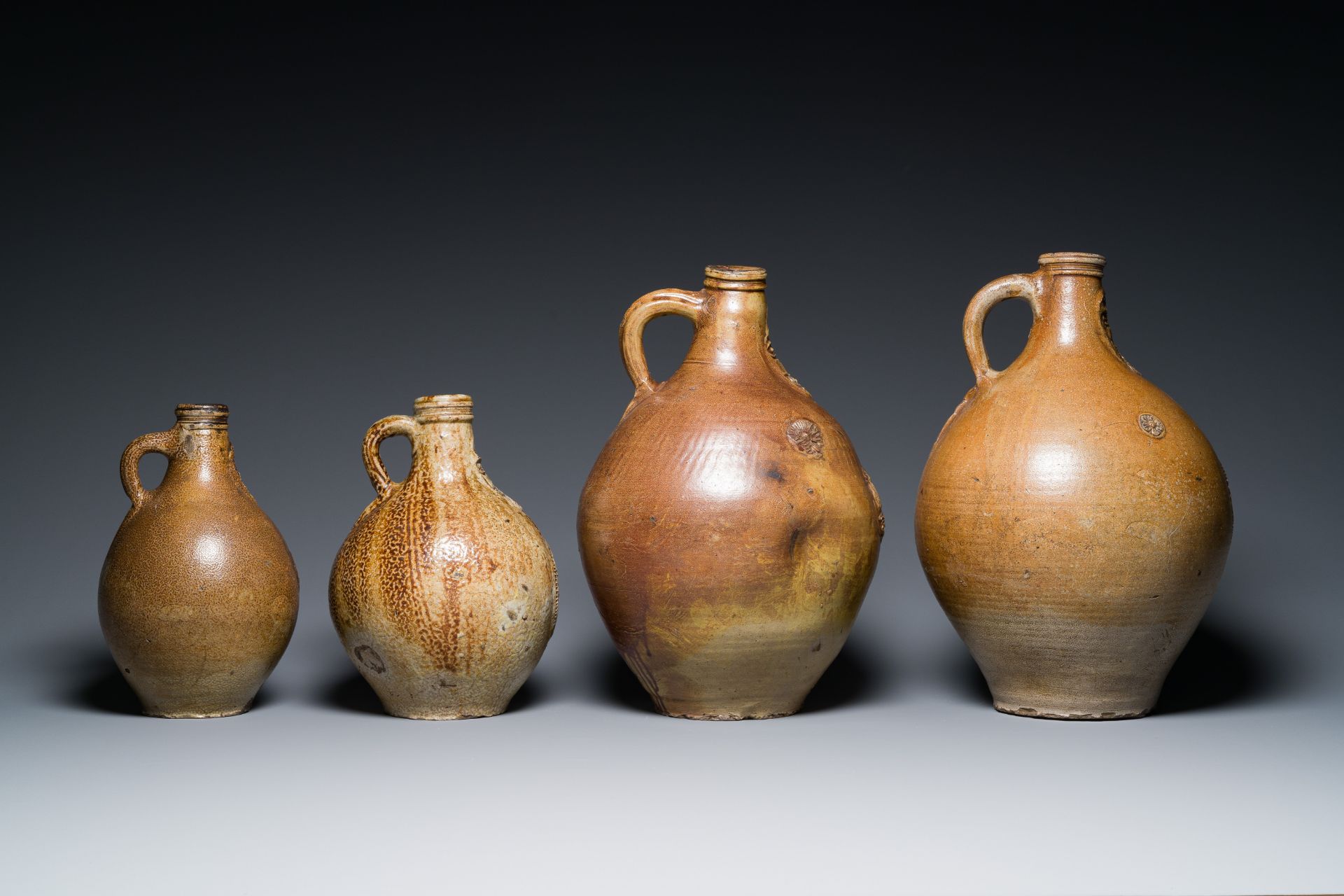 Four stoneware bellarmine jugs with various seals, Frechen and Cologne, Germany, early 17th C. - Image 5 of 7