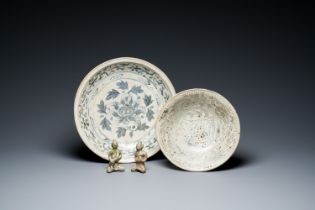 A Vietnamese or Annamese blue and white dish, a Thai Sawankhalok dish and a pair of celadon figures,