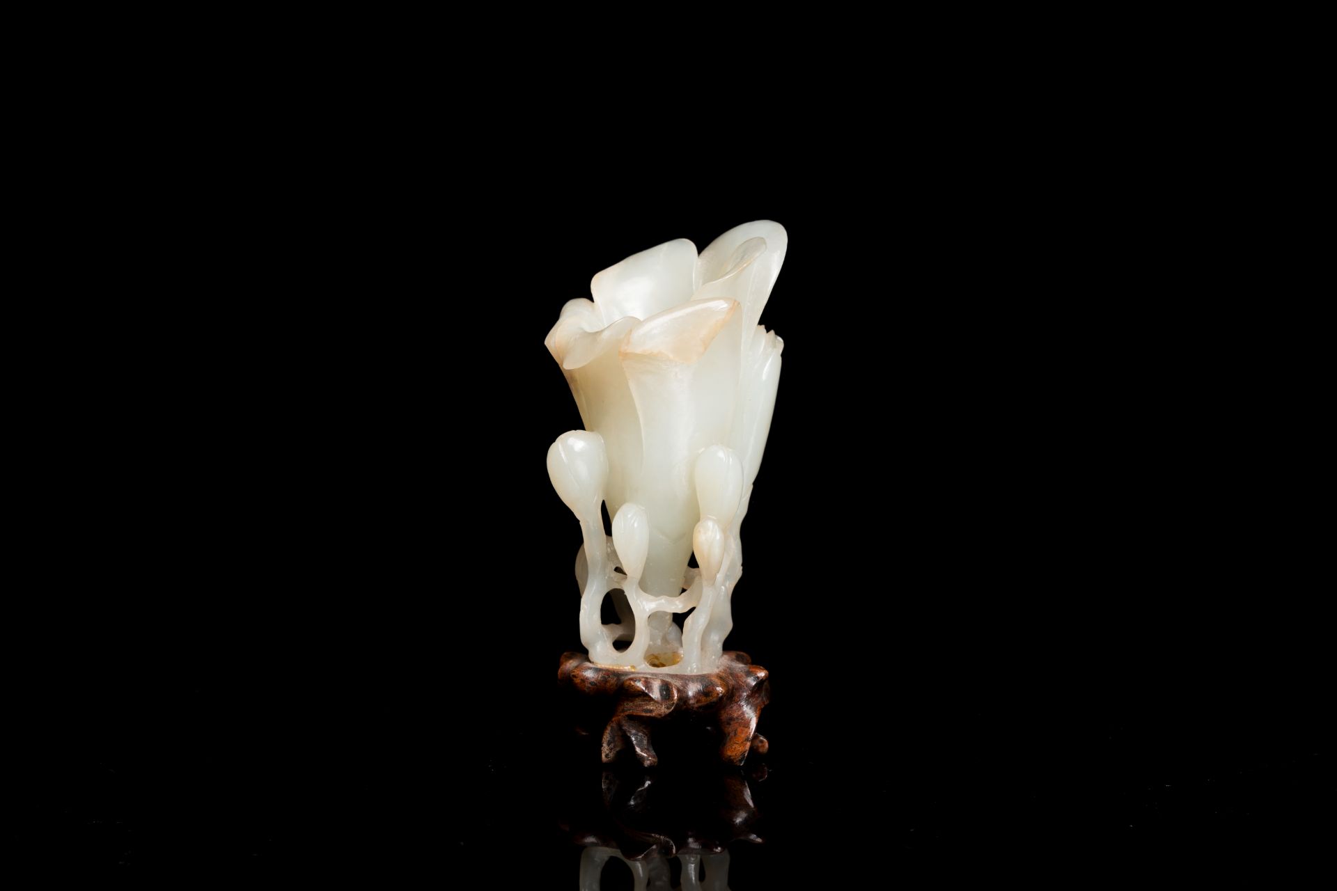 A Chinese white jade 'magnolia' carving, Qing