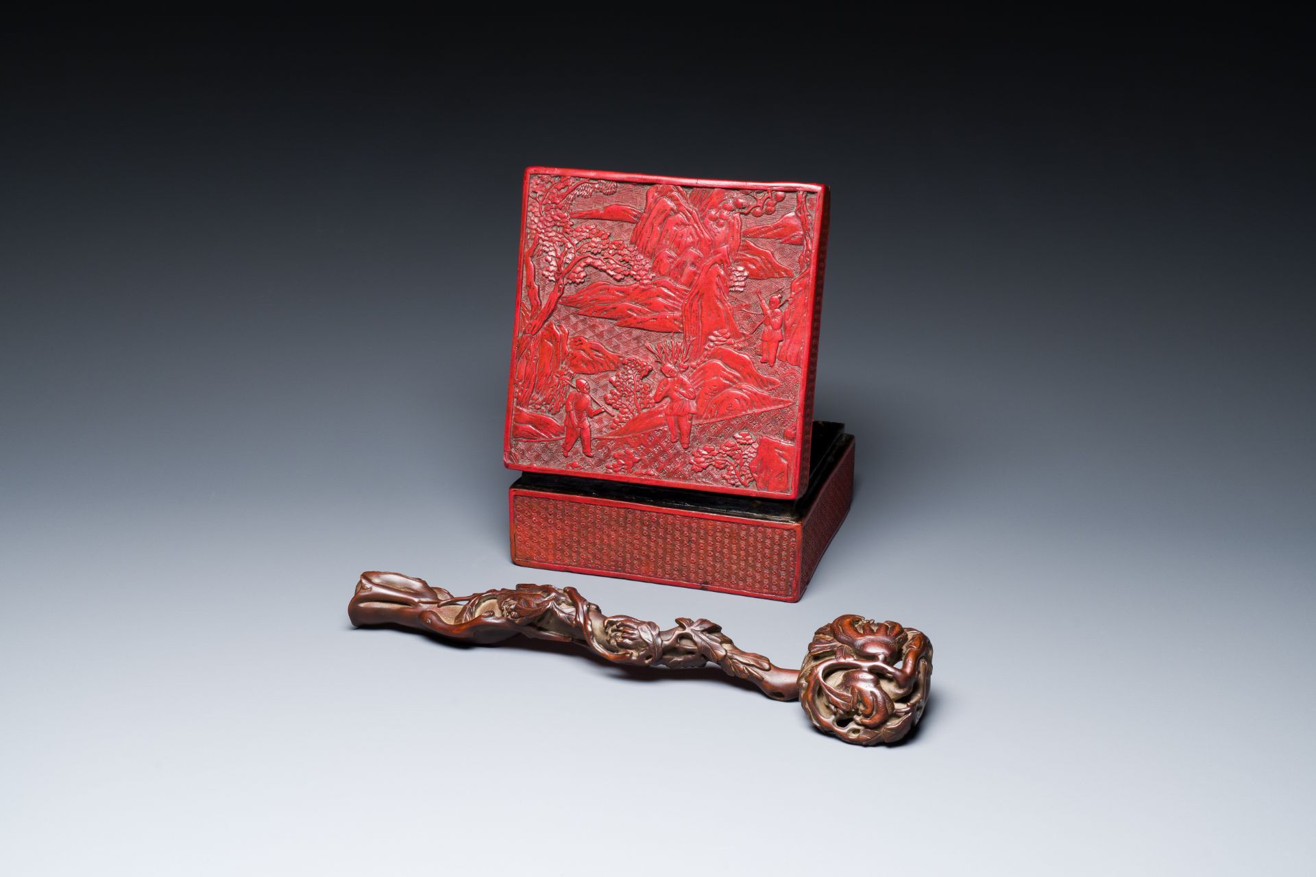 A Chinese carved boxwooden ruyi scepter and a square red lacquer box and cover, Wanli mark, 19/20th