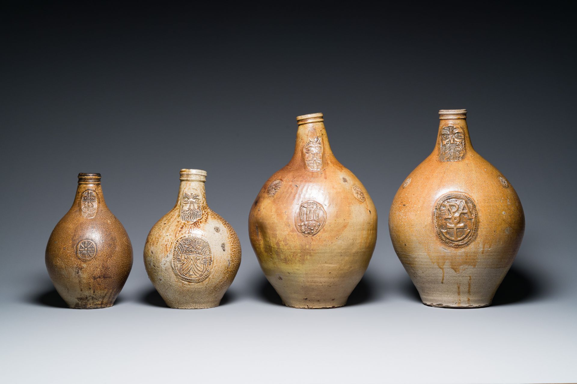 Four stoneware bellarmine jugs with various seals, Frechen and Cologne, Germany, early 17th C. - Image 2 of 7