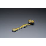 A Chinese Beijing enamel yellow-ground 'bajixiang' ruyi sceptre, Qianlong mark, 19/20th C