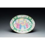 An oval Chinese Canton famille rose dish, Jiaqing/Daoguang