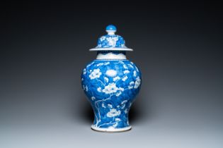 A Chinese blue and white 'prunus on cracked ice' vase and cover, Kangxi