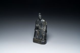 A Chinese monochrome black-glazed figure of Ji Gong, 18th C.