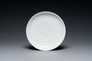 A Chinese Dehua blanc de Chine dish with carved lotus flower design, Ming