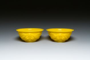 A pair of Chinese yellow Beijing glass bowls with figures in a landscape, CHINA mark, Republic